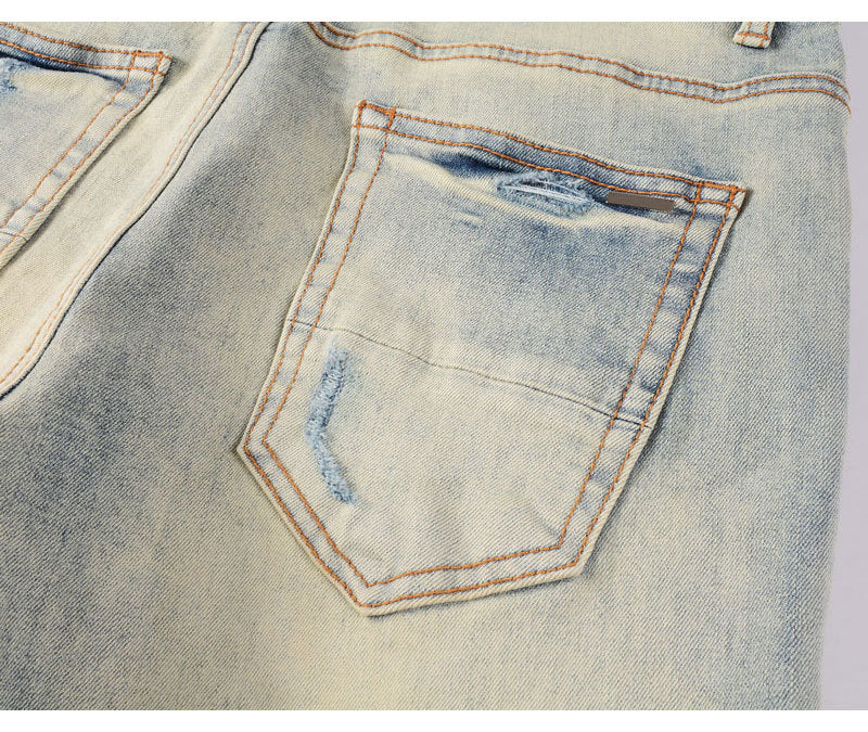 Men's slim fit light blue ripped patches jeans with distressed details and stretchy fabric