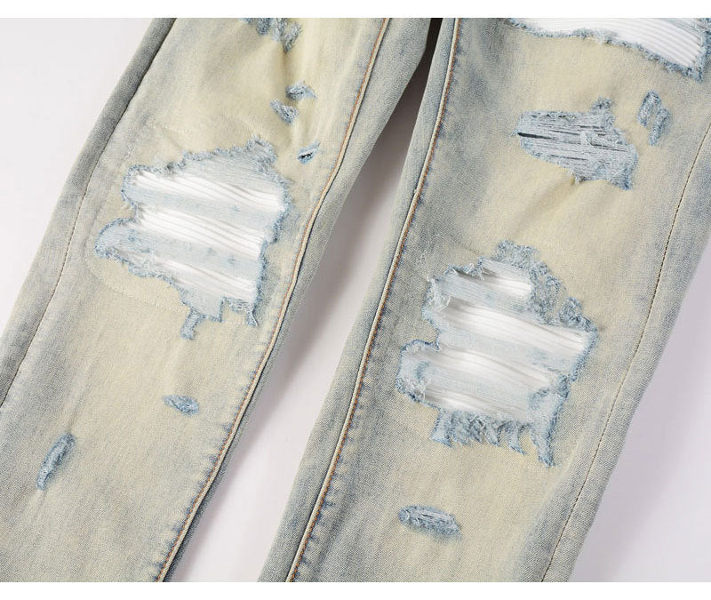 Men's slim fit ripped patches jeans in distressed light blue denim with slight stretch and skinny fit