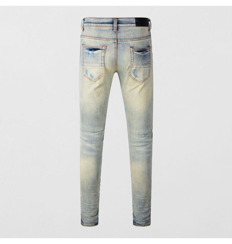 Men's ripped patches jeans in light blue distressed slim fit skinny style