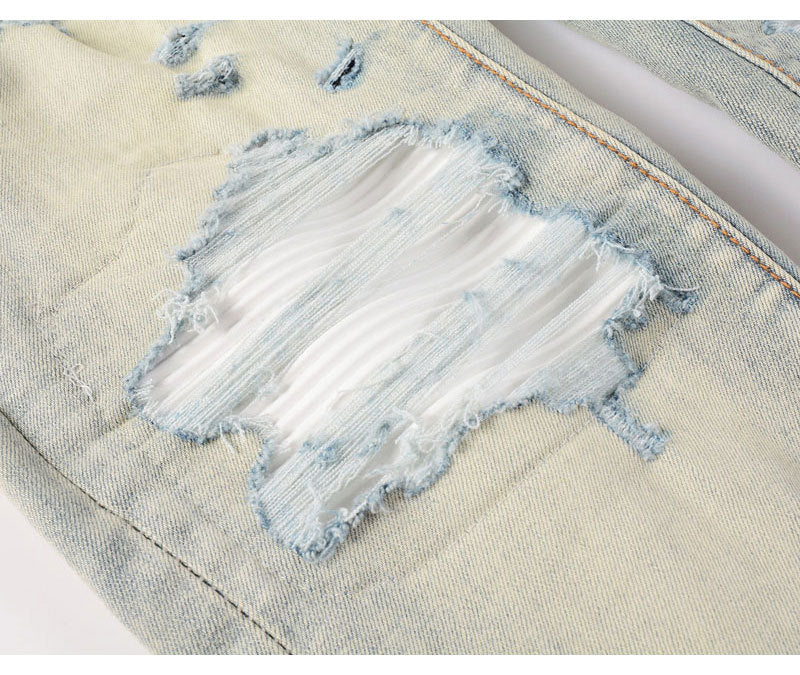 Men's slim fit light blue ripped patches jeans with distressed details and stretchy fabric