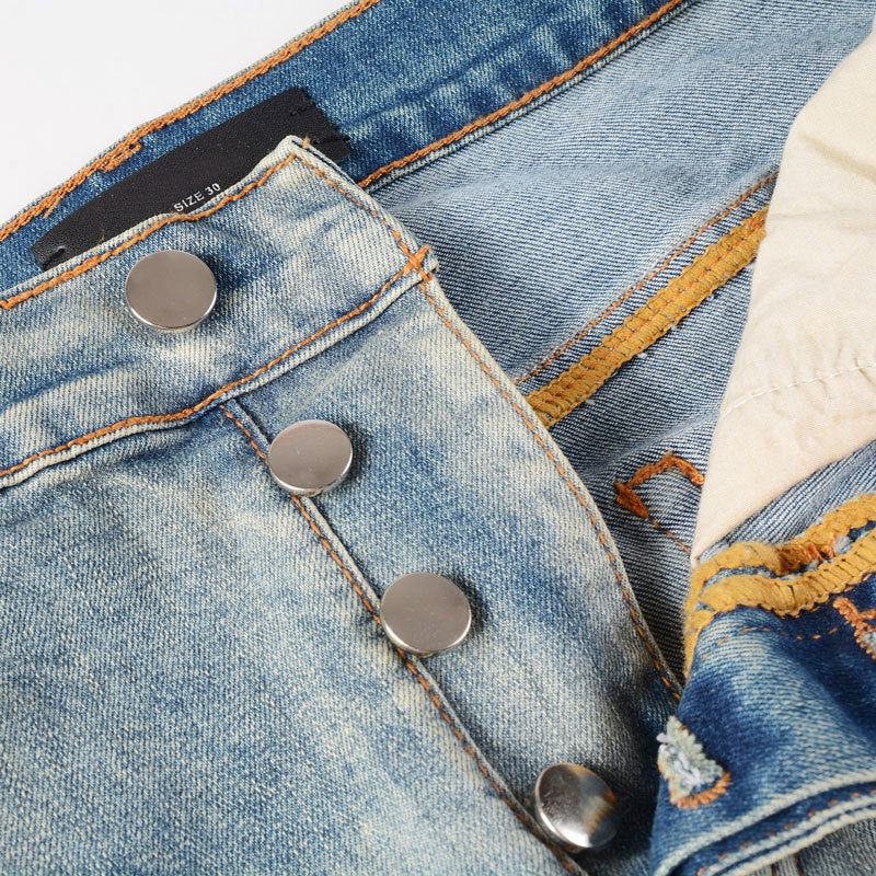 Men's light blue ripped patches jeans with distressed slim fit design