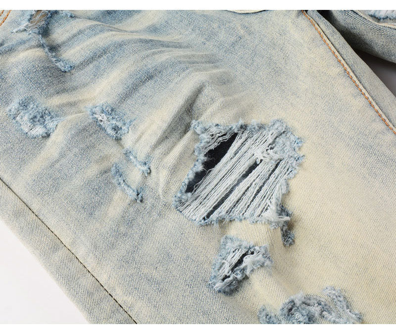 Men's ripped patches jeans in light blue distressed slim fit style