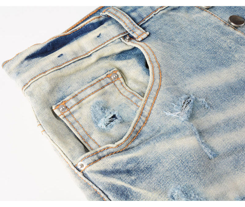 Men's light blue ripped patches jeans with distressed slim fit design