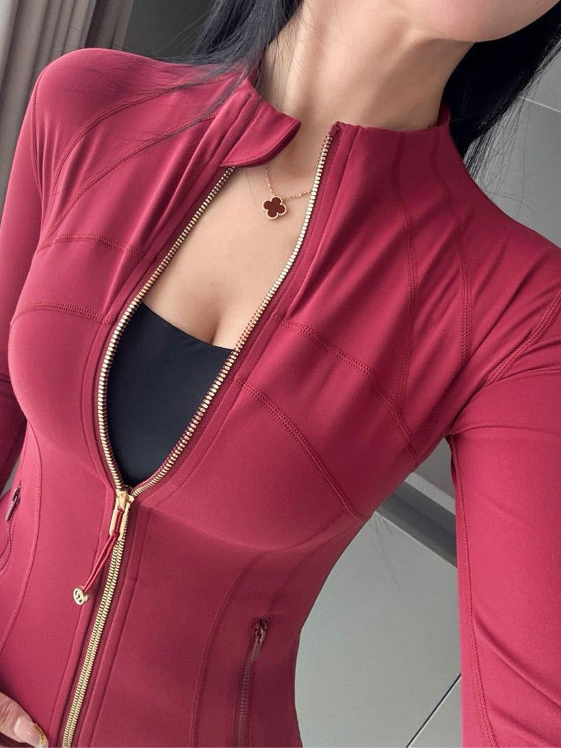 Woman wearing slim fit Golden Edge Define Slim Sports Jacket in Twilight Rose during workout